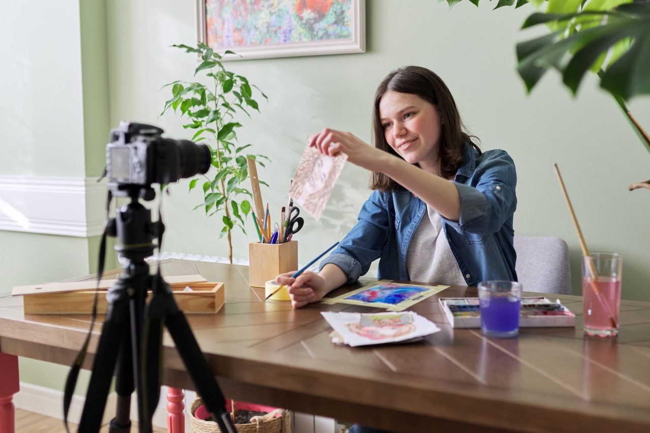 creative girl teenager artist painting in watercolor.jpg